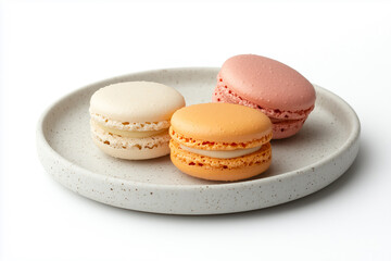Fototapeta premium 3 colorful macarons on a plate. isolated on white background.