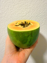 Close-up of a halved papaya, seeds ins ide a papaya. High quality photo