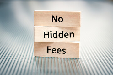 No Hidden Fees. Slogan on wooden signs standing on grooved glass. Concept of honest business and respect for the customer