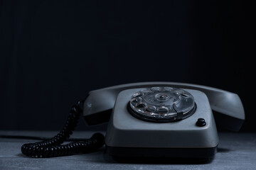 Retro telephone on black background with space for your text.