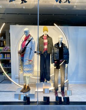 Bracknell, England - January 23, 2025: Winter clothing for women on display in the window of a Next fashion retail store.