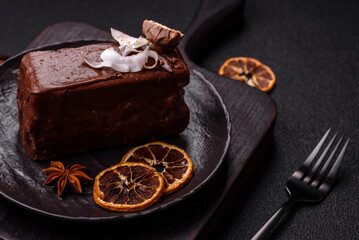 Piece of sweet chocolate bounty cake with coconut flakes and sponge