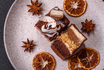 Piece of sweet chocolate bounty cake with coconut flakes and sponge