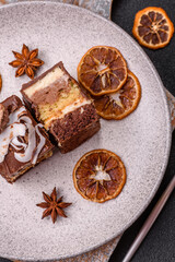 Piece of sweet chocolate bounty cake with coconut flakes and sponge