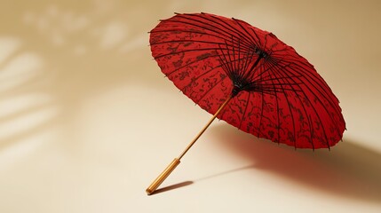 A vibrant red Japanese parasol umbrella rests on a surface, its intricate spokes extending outwards. Its fabric canopy features a traditional Japanese design