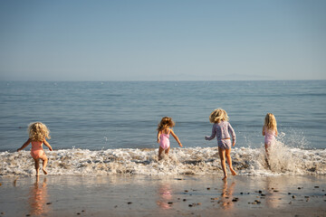 Family Beach, kids playing in the water