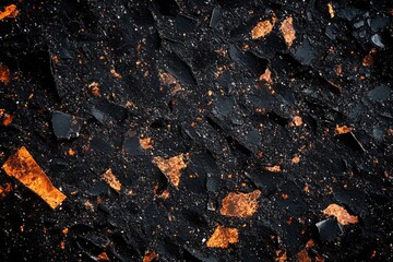A pile of black coal with orange volcanic ash, used for energy production and industry.