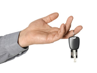 Man with car key and keychain on white background, closeup