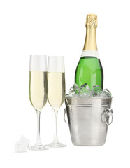 Champagne in glasses and ice bucket with bottle isolated on white