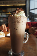 Delicious chocolate drink served in a tall glass