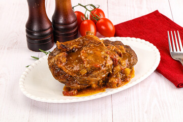 Italian cuisine - ossobuco with sauce
