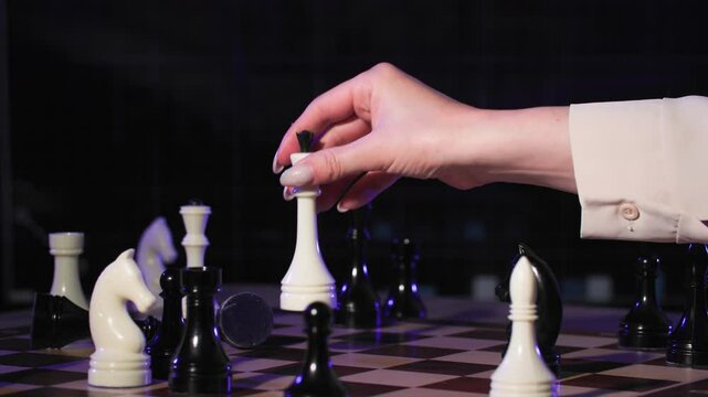 gender inequality, female and male hands playing chess on chessboard