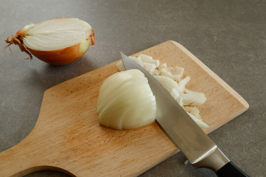 onion and knife on cutting board