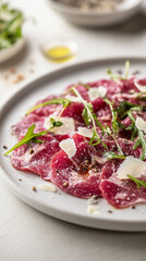 Exquisite beef carpaccio garnished with arugula, parmesan shavings, and edible flowers, captured in a macro shot with natural lighting