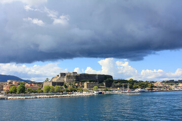 Naklejka premium the old town with the fortress corfu illuminated by the summer sun in greece