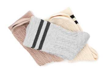 Different soft socks isolated on white, top view