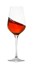 Rose wine splashing in glass on white background