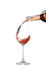Pouring wine into glass on white background