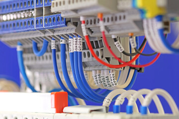 Connection of electrical modules using insulated copper electrical wires. Close-up. Soft focus.
