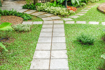 Obraz premium Garden landscape design with pathway in garden and footpath in picturesque summer park and staircase in backyard,Paving stones on floor in park,space for text..