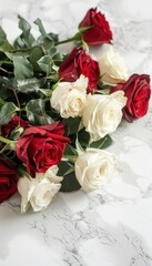 Fototapeta premium Elegant Red and White Rose Bouquet on Luxurious Marble for Romantic Decoration and Design