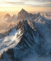 Obraz premium Majestic mountain peaks under golden sunset sky