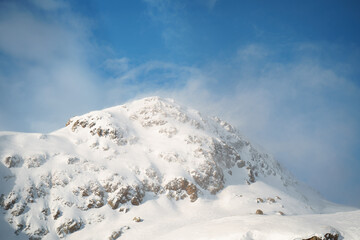 Kreuzjochspitze, Madaunspitze, and Riffelspitze of the Verwall Group in Tyrol and Vorarlberg. Below the peaks lies the Ski Arlberg resort, featuring fantastic and wide ski slopes.