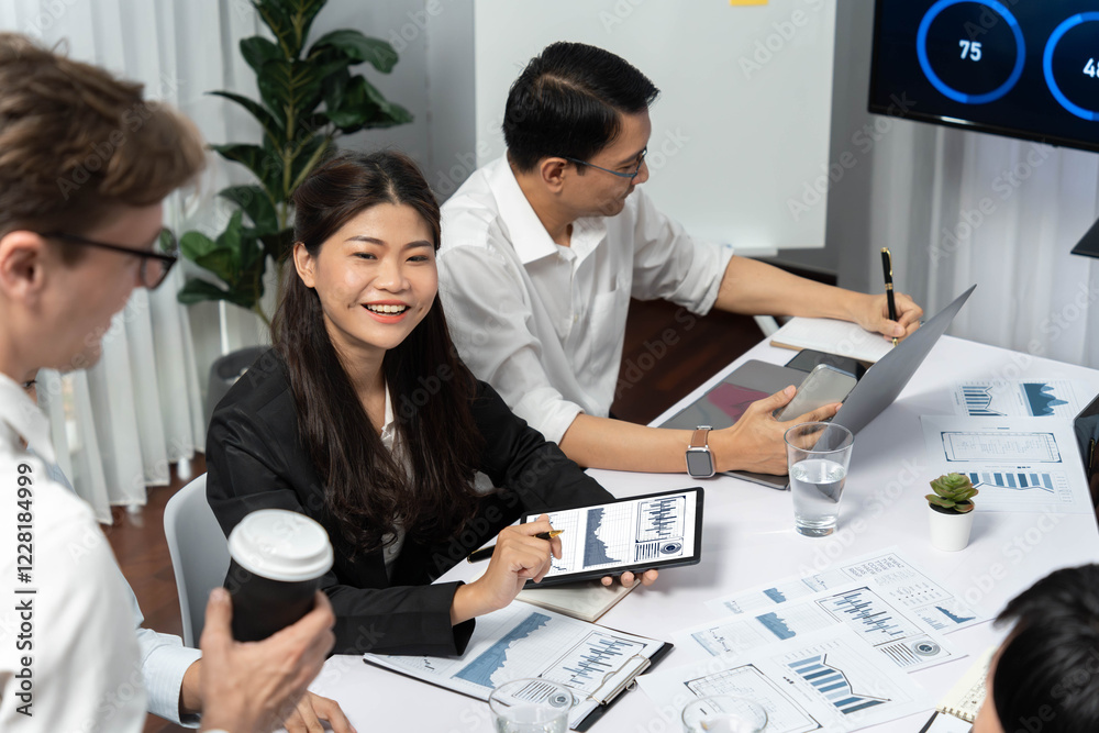 Poster Analyst team utilizing BI Fintech to analyze financial data at table in meeting room. Businesspeople analyzing BI dashboard power on paper for business insight and strategic marketing planning.Prudent