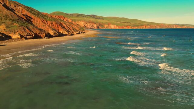 Aerial view of seascape along the vast beach on the South Coast during summer