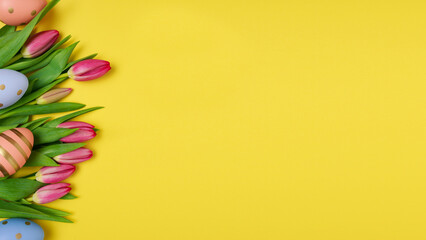 Card of Easter Day. Easter eggs with tulips on a yellow background