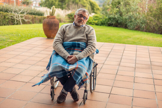 Compassionate Care for Elderly in Wheelchair Outdoors