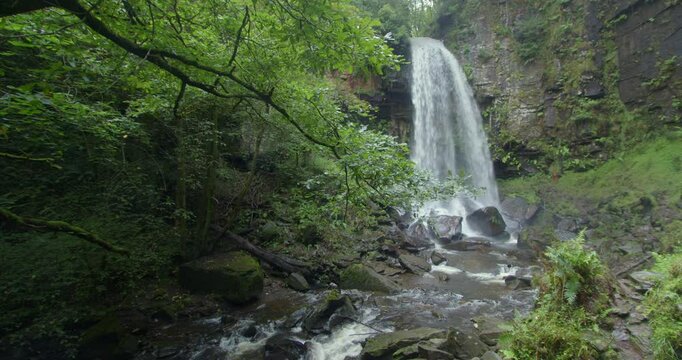 Extra wide shot of Melin Court waterfall right of frame at Melin Court nature reserve