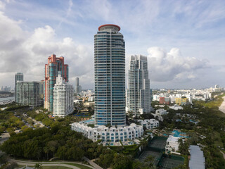 Fototapeta premium Skyscraper architecture of Miami in cloudy weather. Luxurious vacation. Miami South beach landscape aerial view. Aerial Miami skyscraper. Aerial Miami south beach. Cityscape landscape of South Beach