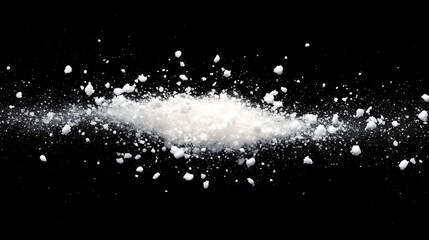 Snow particles, floating in space, against a black background