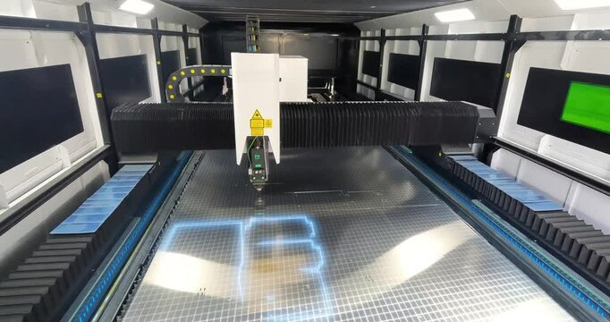 Metal laser cutting machine. CNC laser cutting machine at work. Cutting metal with a laser CNC machine. Smart Industry concept