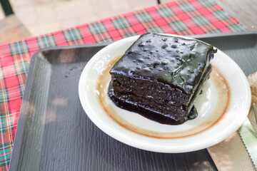 Homemade dark chocolate fudge brownies cake,Traditional French sweet dessert in forest,Delicious Homemade pastries,selective focus.