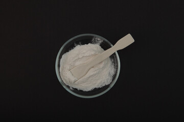  Sodium Carboxymethyl Cellulose Powder, NaCMC in Petri dish, top view. Food additive E466. Thickening and Suspending agent in Condiments, and Sugarless Beverages.