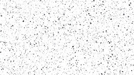 Abstract Black Speckles Scattered Across White Background