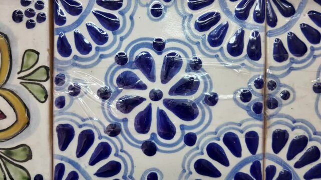 Two tiles with flowers on them