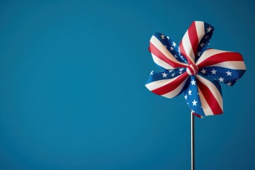 a pinwheel with an American flag pattern against a blue background, symbolizing the spirit and colors of America Generative AI