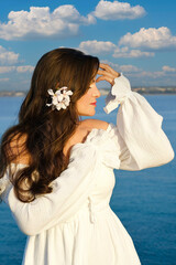 girl against the background of the sea, close-up