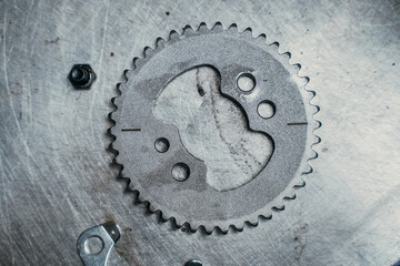Elaborate and intricate gear design displayed on a refined metal surface material