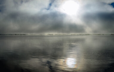  morning fog over the St. Lawrnence River showing the far coastline.