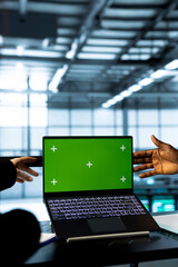 Computer scientists in data center using green screen notebook, observing analytics, reviewing...