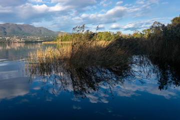 reflections on Lake Varese on a summer morning