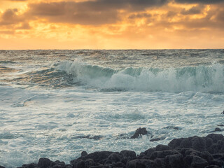 Powerful ocean waves and pastel sky. Nature scene with water and clouds. Nobody. Rough power and energy concept.