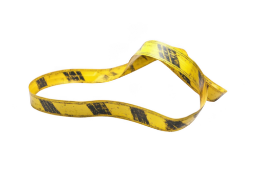 Yellow Caution Tape Floats Through the Air, Twisted and Tangled Ribbon Concept.