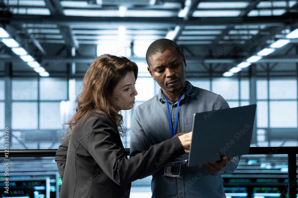 Poster computer scientists in data center using notebook, integrating green technologies. african american 