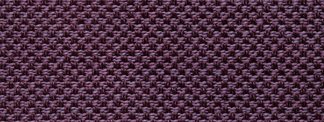 Texture dark purple background from woven textile material with wicker pattern, macro. Structure vintage violet fabric