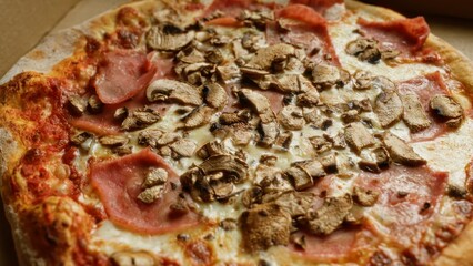 Delicious crispy pizza topped with ham, mushrooms, and golden cheese, capturing the essence of italian cuisine in a mouth-watering close-up shot